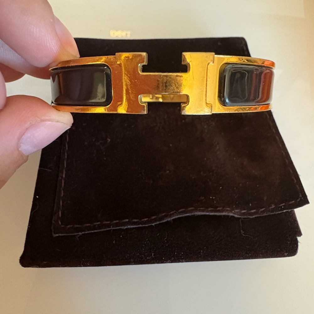 Hermes Gold and Black H Cuff Bracelet with receipt, box and bag.